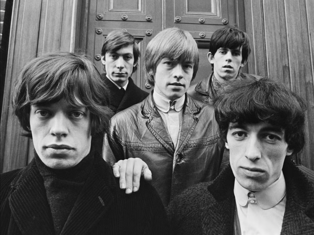 Five men standing in front of a door
