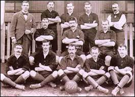 old photo of a bunch of men standing for a photograph