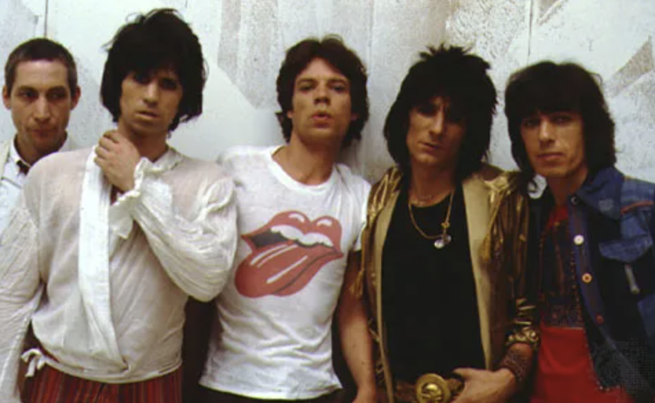 Five men standing in a row
