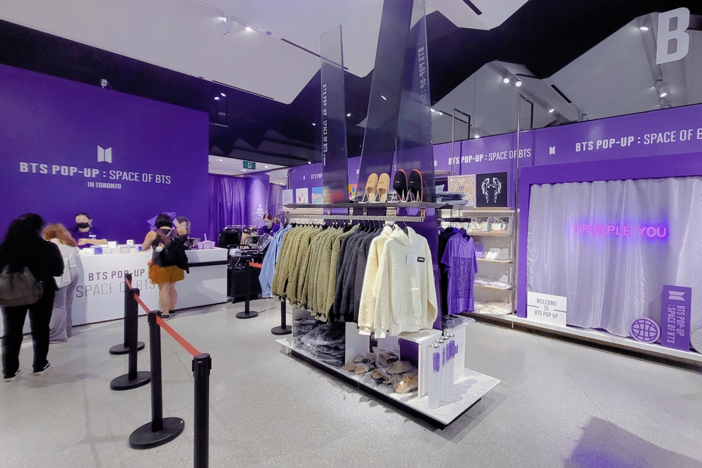 BTS merch on racks in a store