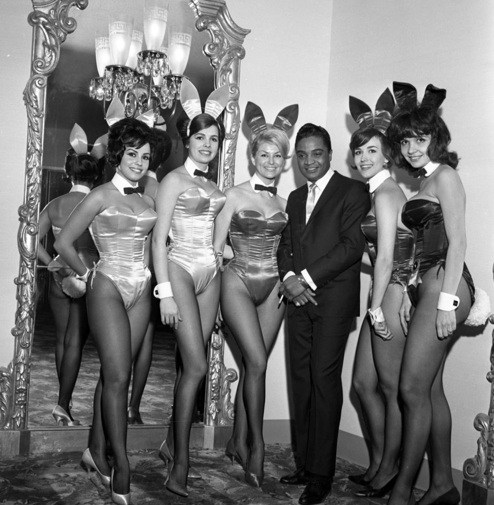 black adn white photo of women wearing bunny ears