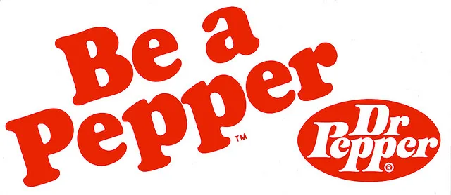 red and white sign with slogan