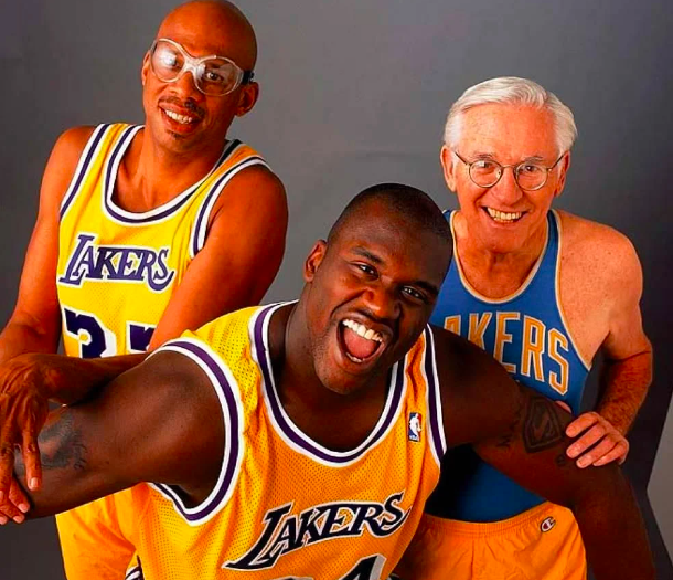 three men wearling LA Lakers uniforms 