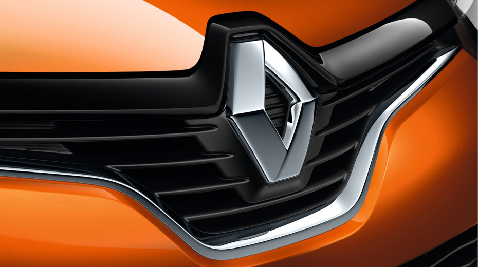 Renault Logo on front of orange car 