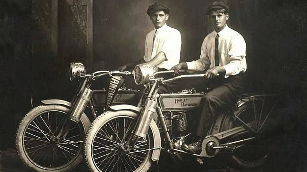 men on old motorcycles